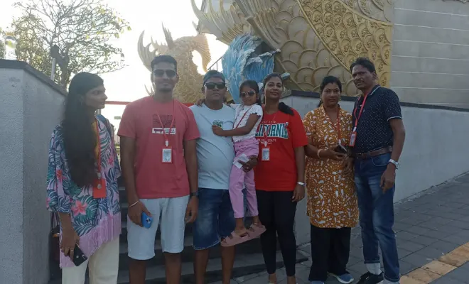 Happy travelers enjoying Bali Transport From Airport service